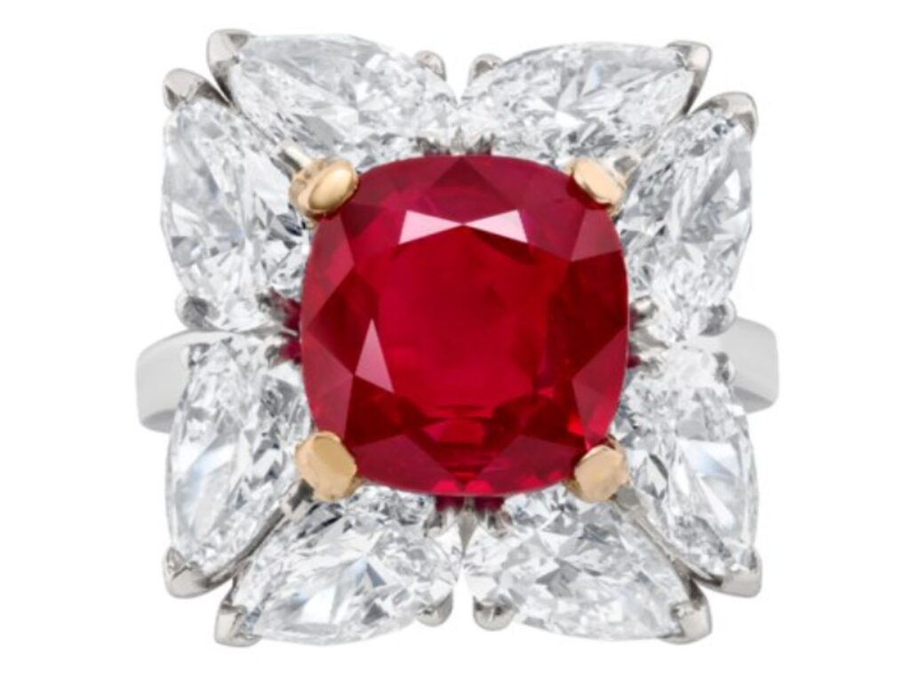 Burmese ruby center stone, surrounded by pear-shaped diamonds image.