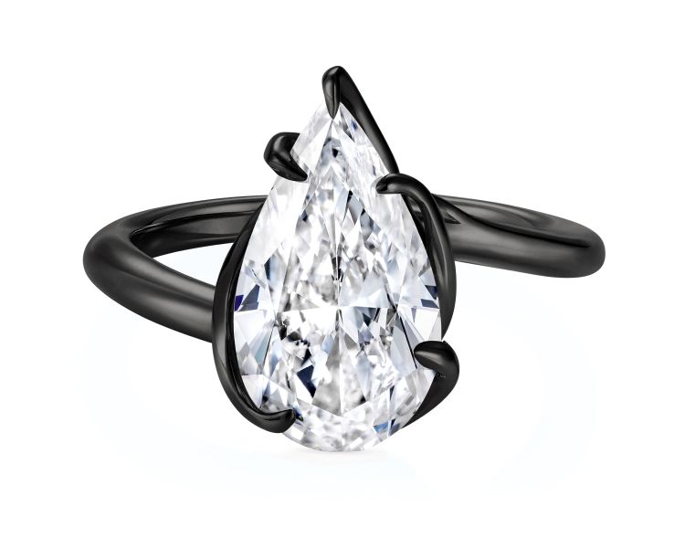 Rebel Black ring in 18-karat gold and ceramic with pear-cut diamond center. (Thelma West)