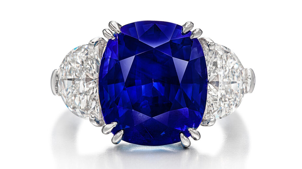 Cushion-shaped Kashmir sapphire set between two half-moon-shaped diamonds ring image