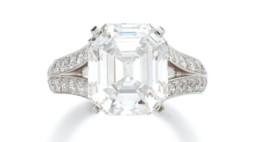 Cartier diamond ring set between bifurcated diamond shoulders image