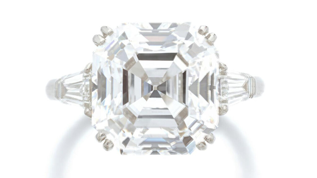 Diamond ring set between tapered baguette-cut diamonds image