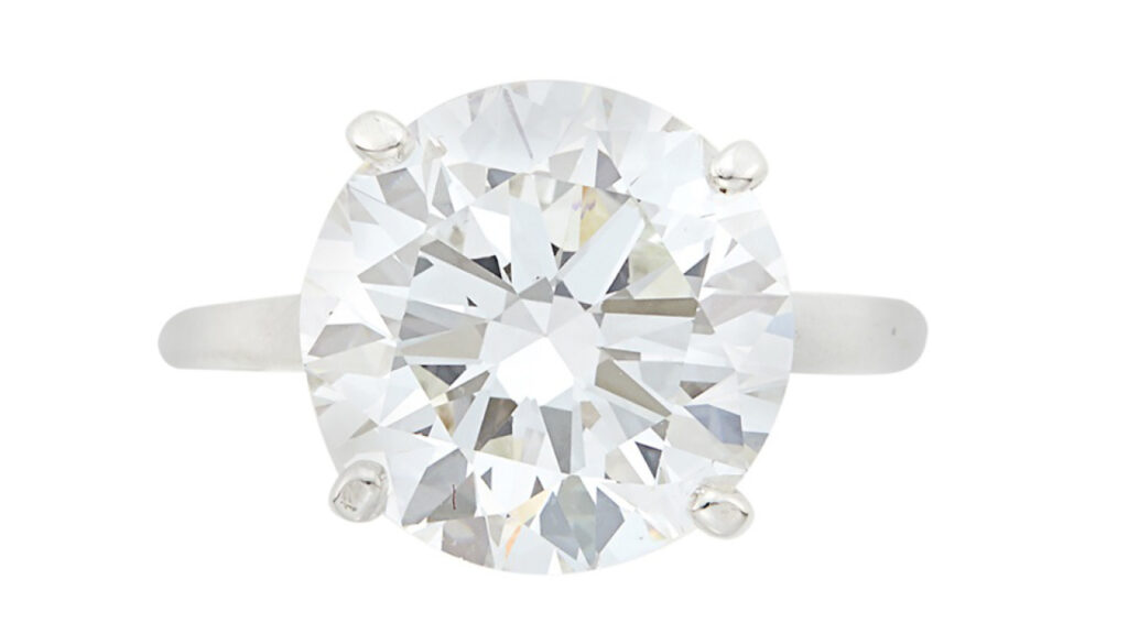 Round-cut diamond and silver ring at Doyle image