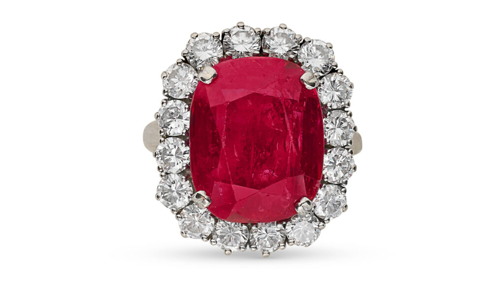 Antique cushion Burmese ruby surrounded by round brilliant-cut diamonds ring at Christie's image