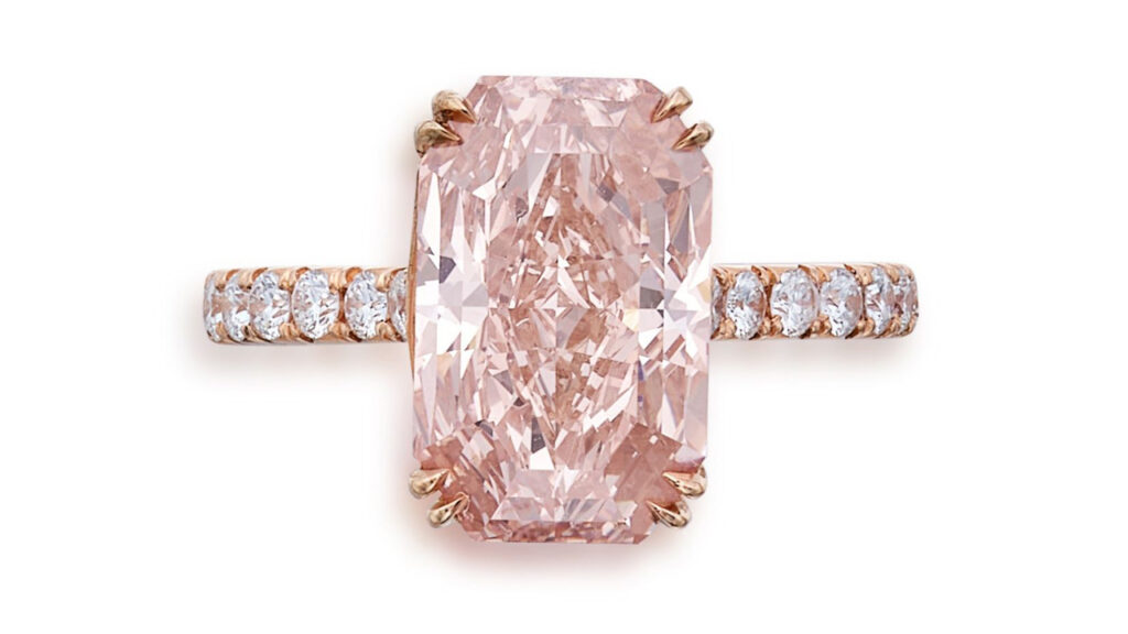 Cut-cornered rectangular mixed-cut, fancy-orangey-pink diamond ring at Sotheby's image