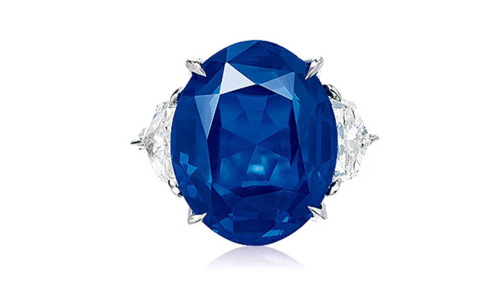 Oval-shaped Burmese sapphire framed by shield and circular-cut diamonds at Poly Auction image