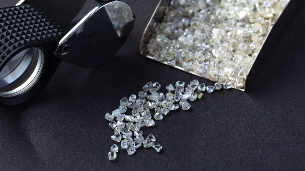 Rough diamonds in a shovel image