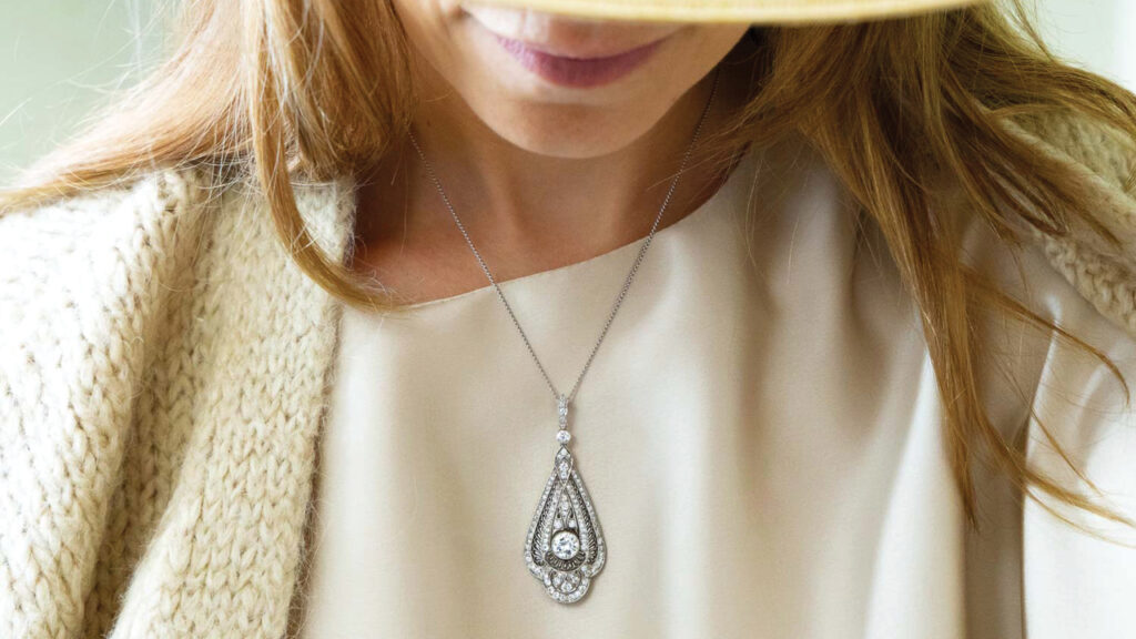 Model wearing a diamond pendant from Jewelers Circle image