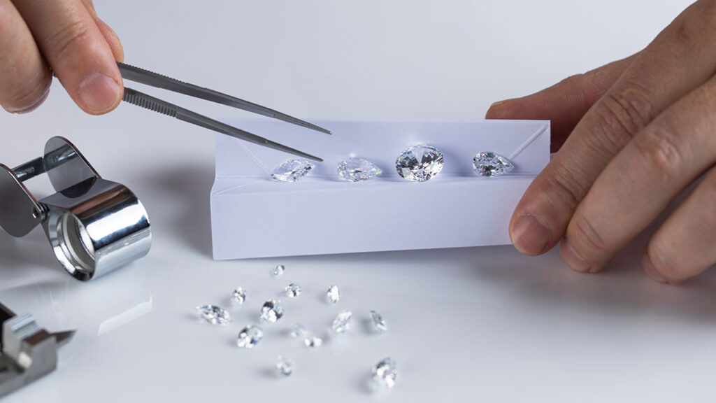 Polished diamonds being sorted image