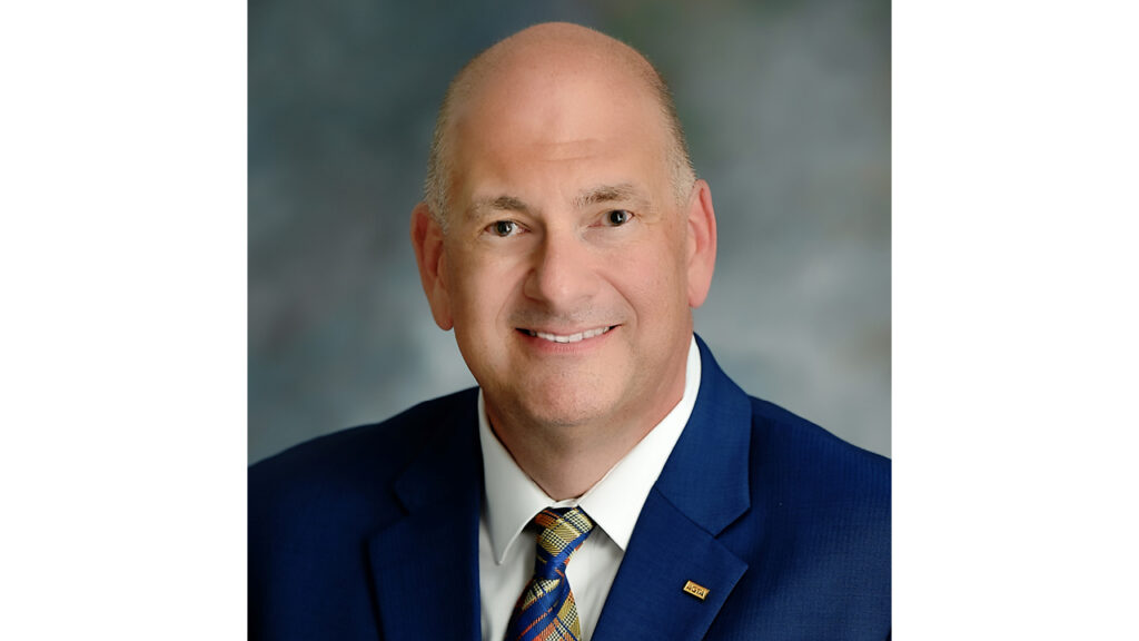 Headshot of John W. Ford, Sr., CEO of the American Gem Trade Association