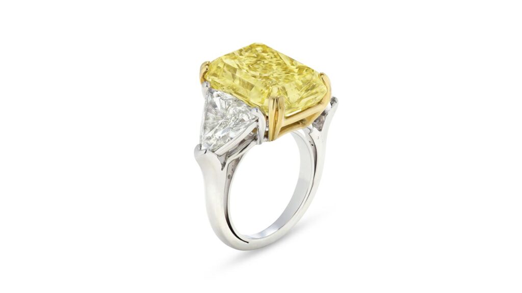 Ring featuring a cut-cornered rectangular mixed-cut fancy-intense-yellow diamond at Christie's image.