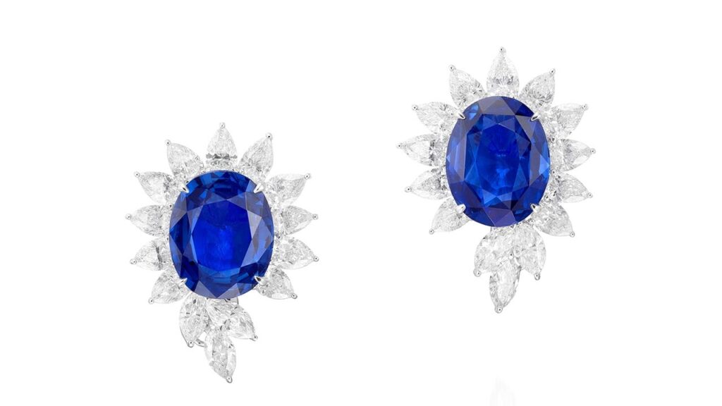 Pair of earrings featuring oval sapphires surrounded by pear- and marquise-shaped diamonds at Phillips image