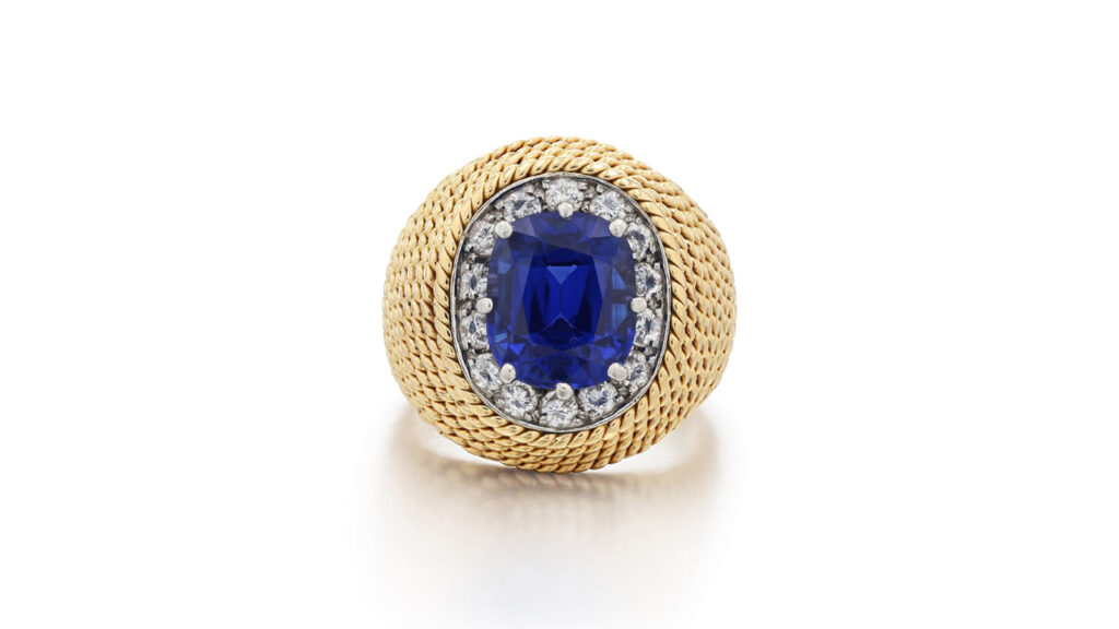 Ring containing a Kashmir sapphire within a brilliant-cut diamond surround at Sotheby's image