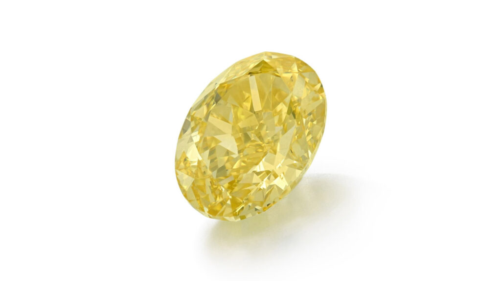 Ring bearing an oval-shaped, 6.60-carat, fancy-vivid-yellow, internally flawless diamond at Sotheby's image