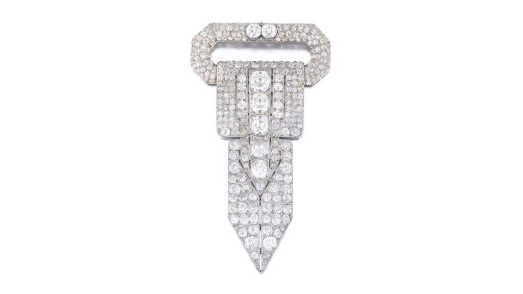 Brooch with a rectangular motif that has an articulated tie, set with circle-cut and cushion-shaped diamonds at Sotheby's image