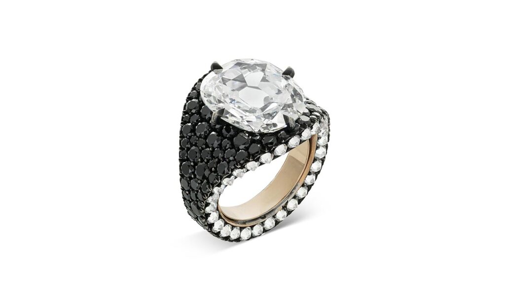 Ring bearing a cushion modified brilliant-cut, 6.36-carat diamond with additional diamonds and black diamonds at Christie's image
