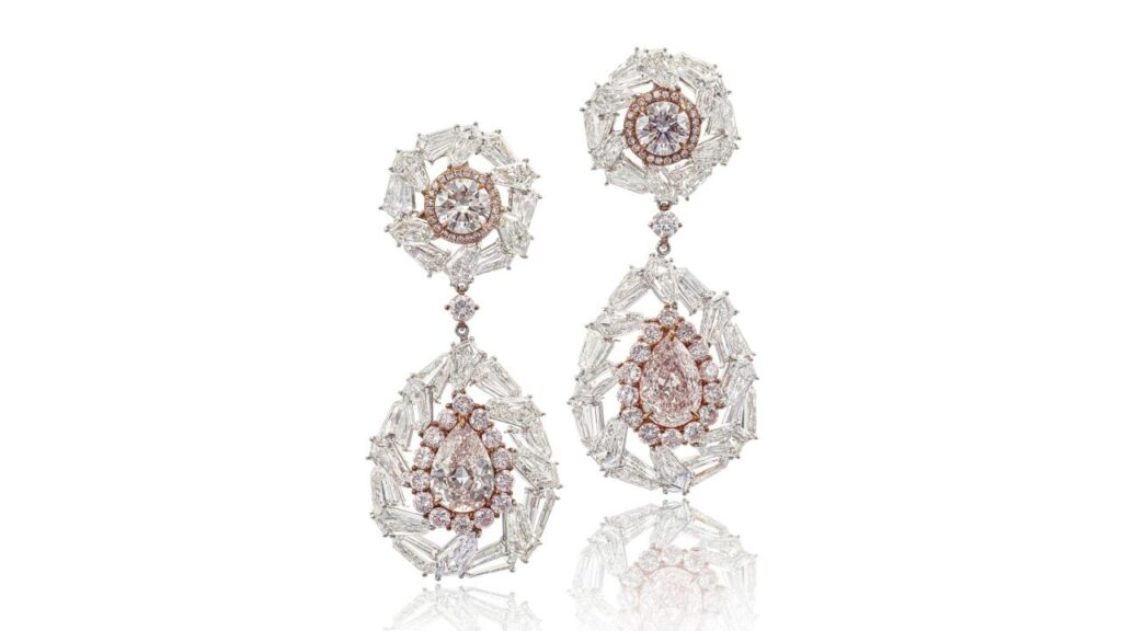 Pair of earrings, each featuring a pear-shaped diamond, light-pink stone, suspended from pink diamonds weighing at Sotheby's image