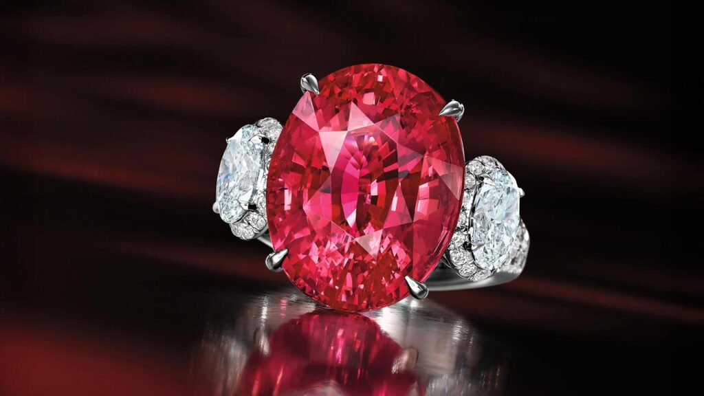 Ring featuring red Tanzanian spinel between two diamonds at Bonhams image