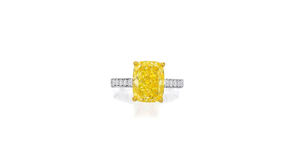 Ring sporting a cushion-shaped, fancy-vivid-yellow, SI2-clarity diamond at Bonhams image
