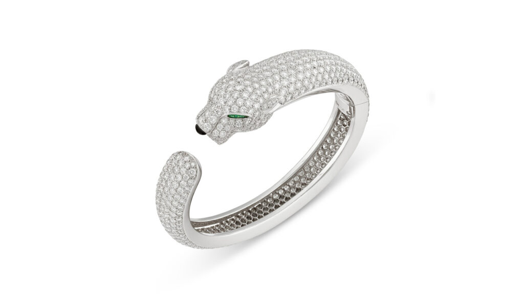 Cartier bangle featuring pear-shaped emeralds, onyx cabochon and round diamonds at Christie's image