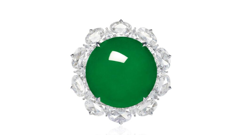 Jadeite cabochon ring in a multi-cut-diamond surround at Poly Auction image