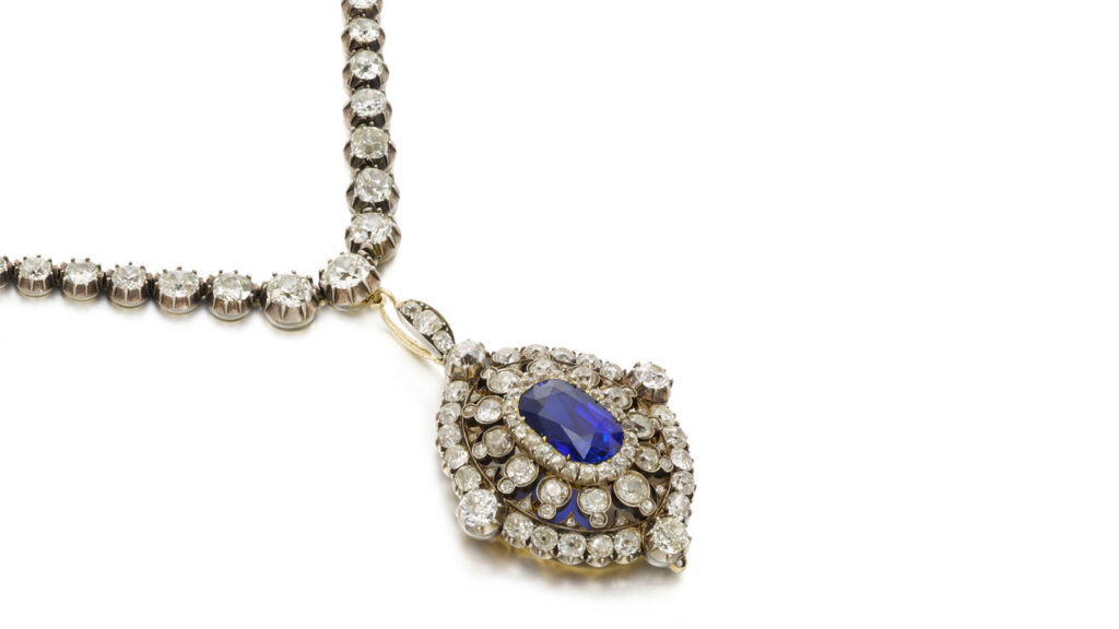 Ceylon sapphire, surrounded by cushion-shaped diamonds, pendant necklace at Sotheby's image
