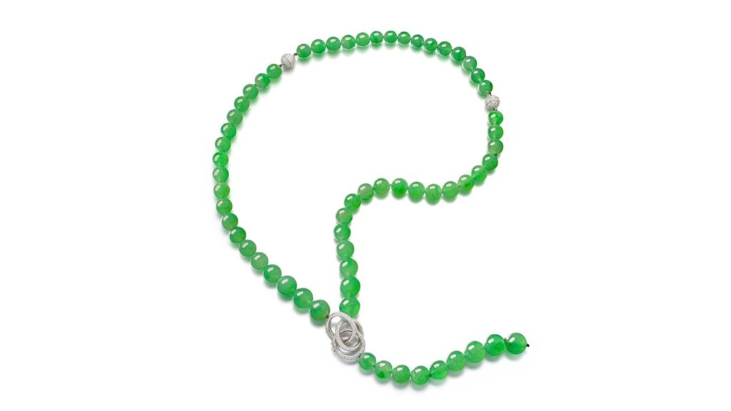 Jadeite beads spaced by clasps set with brilliant-cut diamonds necklace at Sotheby's image