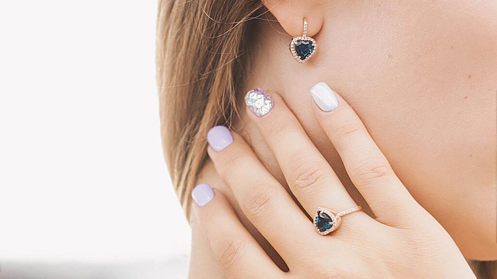 Woman wearing diamond and gemstone jewelry image
