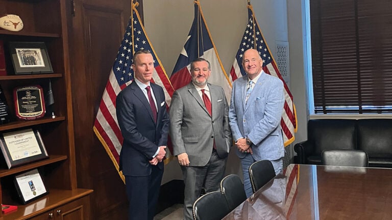 From left, AGTA board president Bruce Bridges of Bridges Tsavorite, US Senator Ted Cruz, and AGTA CEO John W. Ford, Sr. image