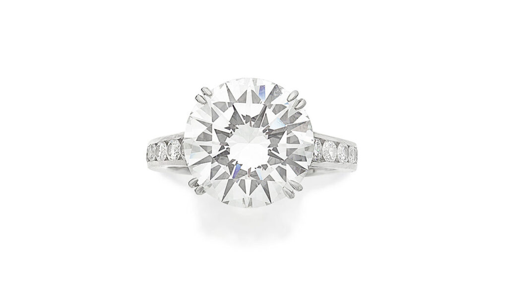 Boodles ring featuring a brilliant-cut diamond between smaller brilliant-cut diamond shoulders at Bonhams image