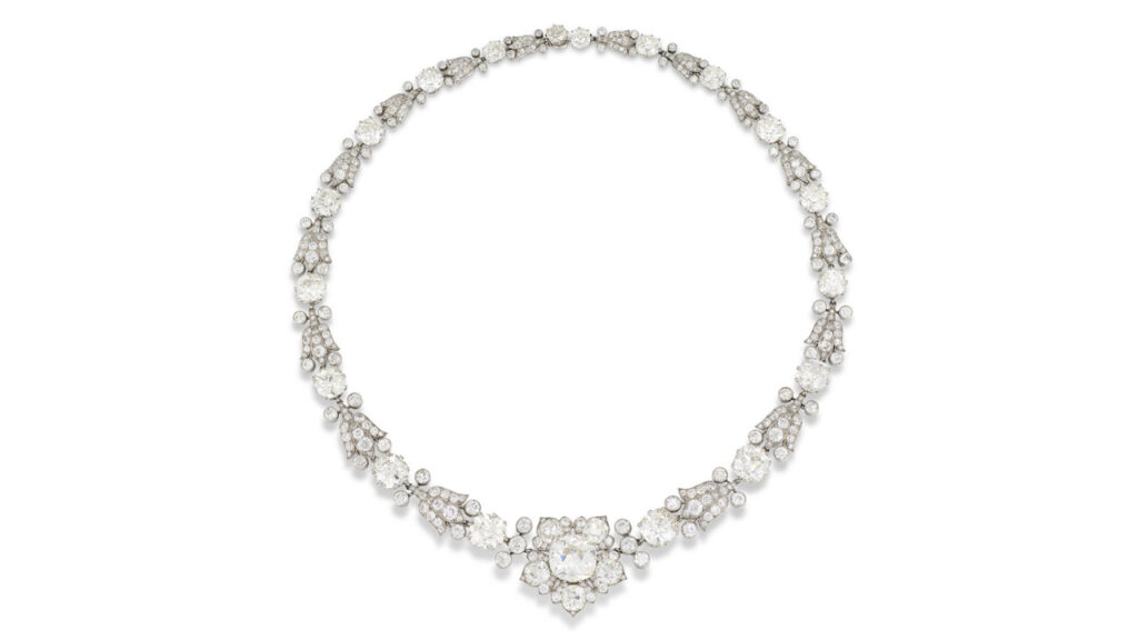 Necklace featuring a series of graduating old cushion-shaped diamonds with a center stone, spaced by bell flower links with old-, circular- and single-cut diamonds at Christie's image