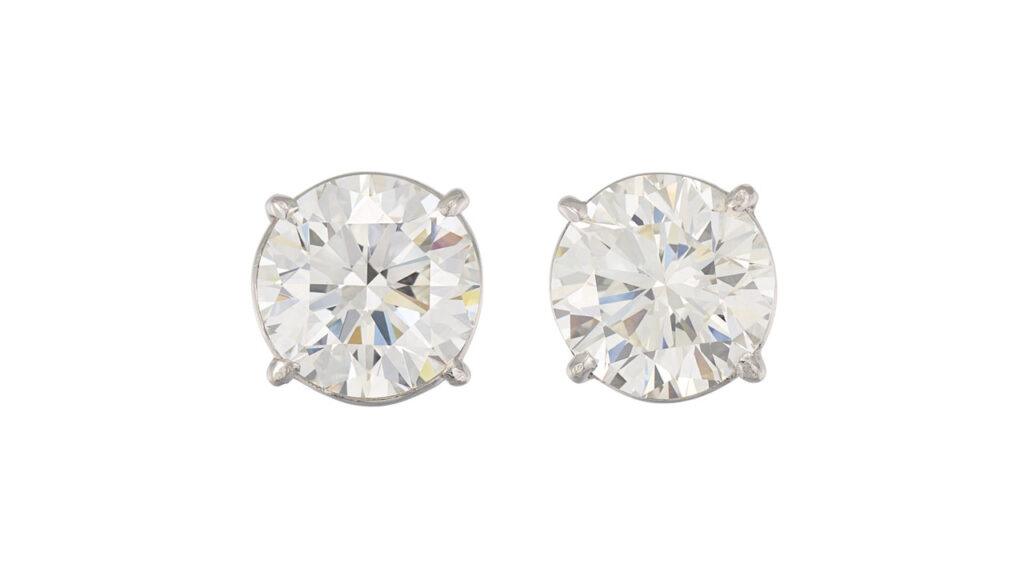Earrings contain round brilliant-cut diamonds at Christie's image