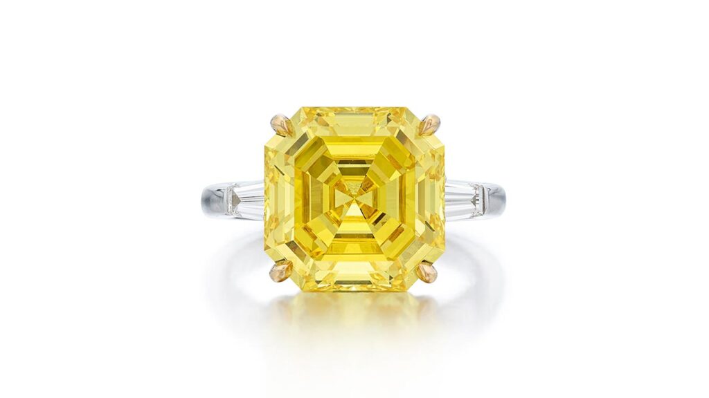 Ring featuring a square emerald-cut fancy-vivid-yellow diamond, set between a pair of tapered baguette diamonds at Sotheby's image
